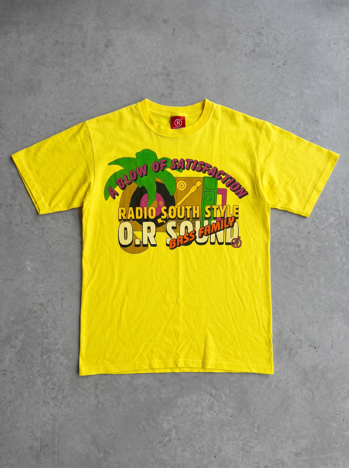 O.R. Sound Family "A Blow of Satisfaction" Yellow Graphic Tee